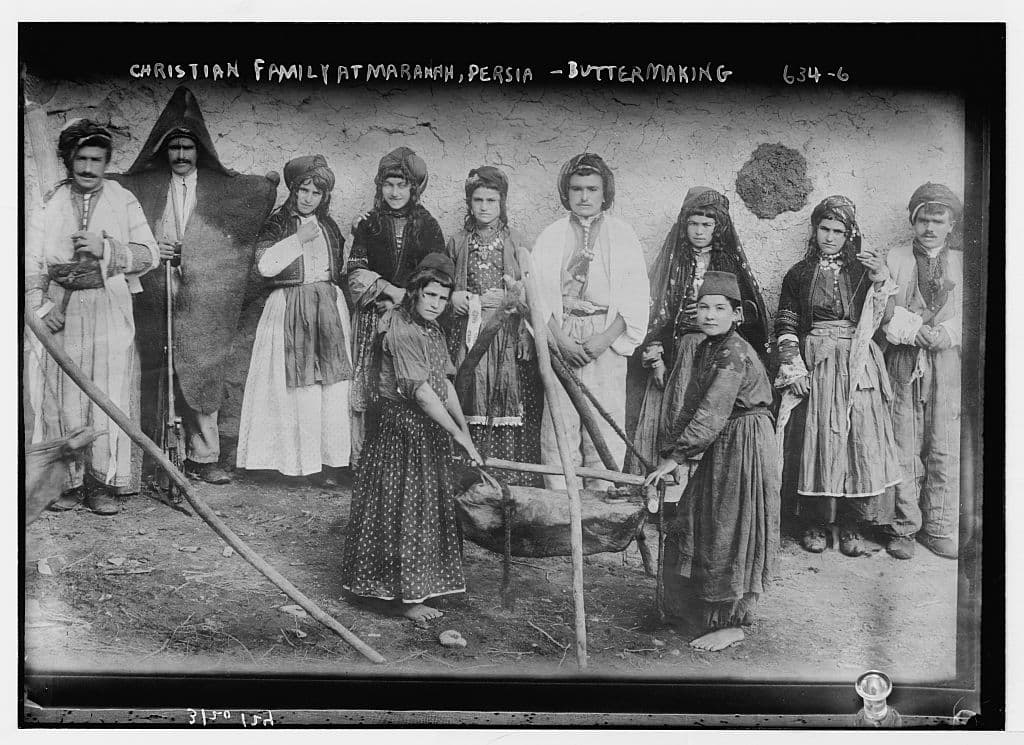 Nestorian (Assyrian) Christian family making butter, Mawana, Persia