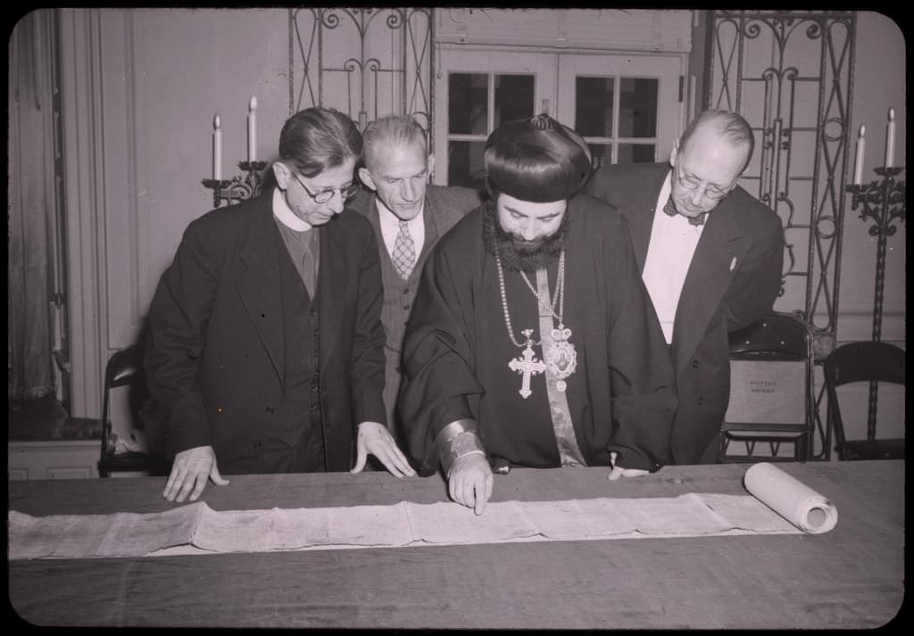 Metropolitan Athanasius Yeshue Samuel with a Dead Sea scroll, 1949