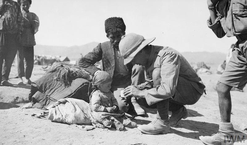 British soldier tending a Jilu Assyrian refugee child