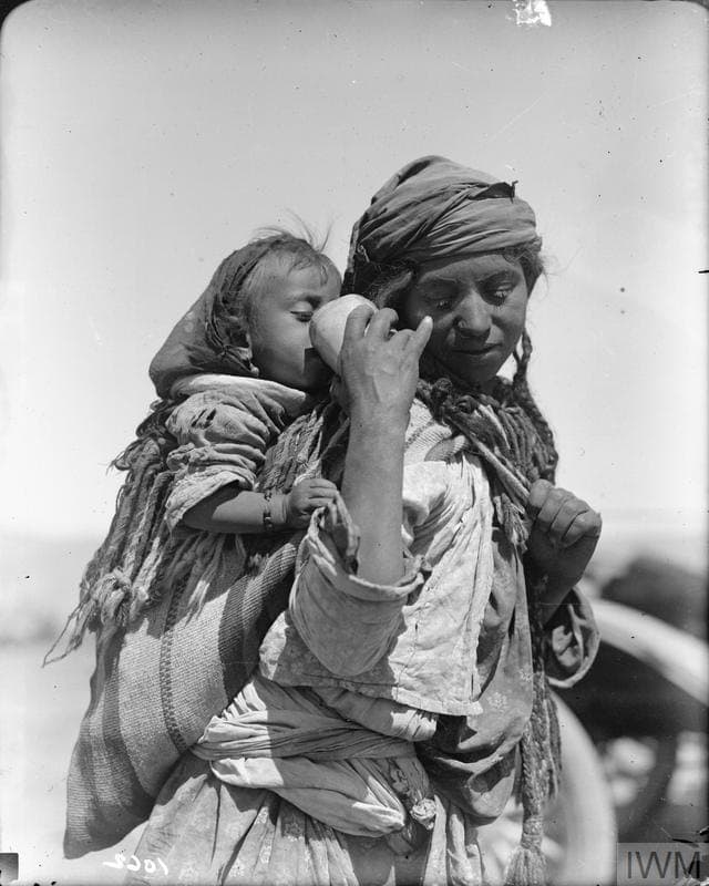 Jilu Assyrian mother giving her child a drink, 1918