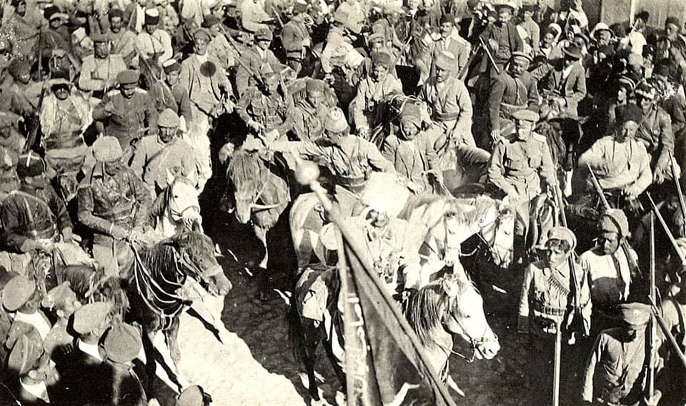 Assyrian volunteers with a captured Turkish banner, 1918