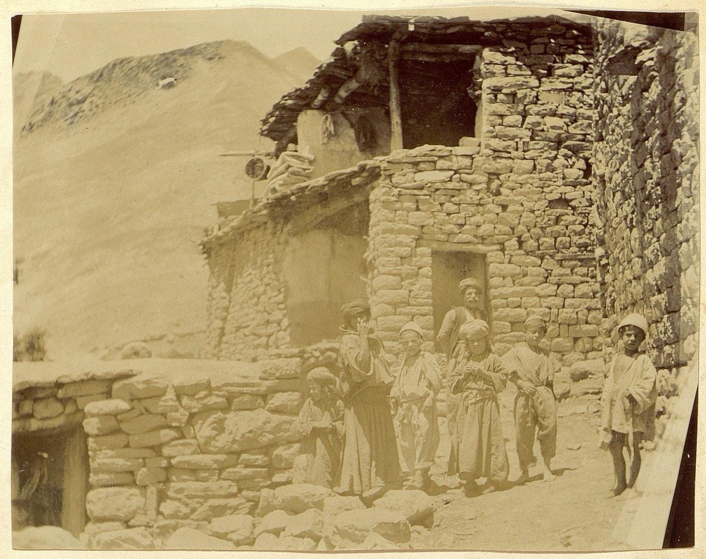 Assyrian family before a stone house in Hakkari, c. 1900