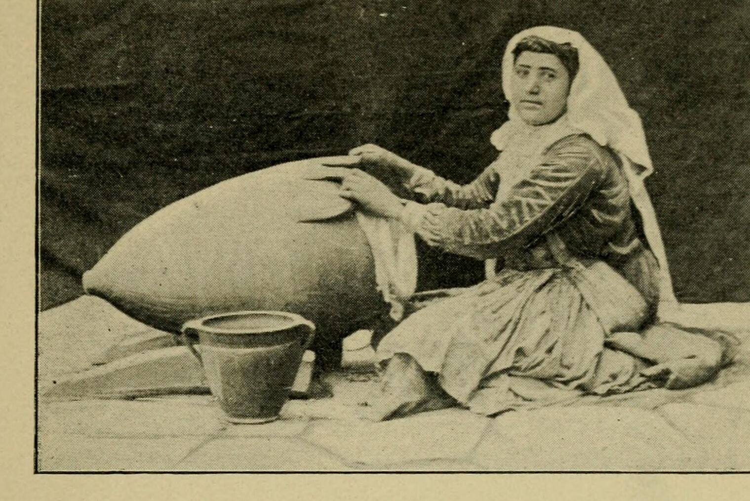 Nestorian (Assyrian) woman churning