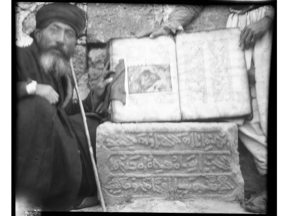 Elderly priest with an illuminated gospel at Mor Philoxenos, Midyat, 1909