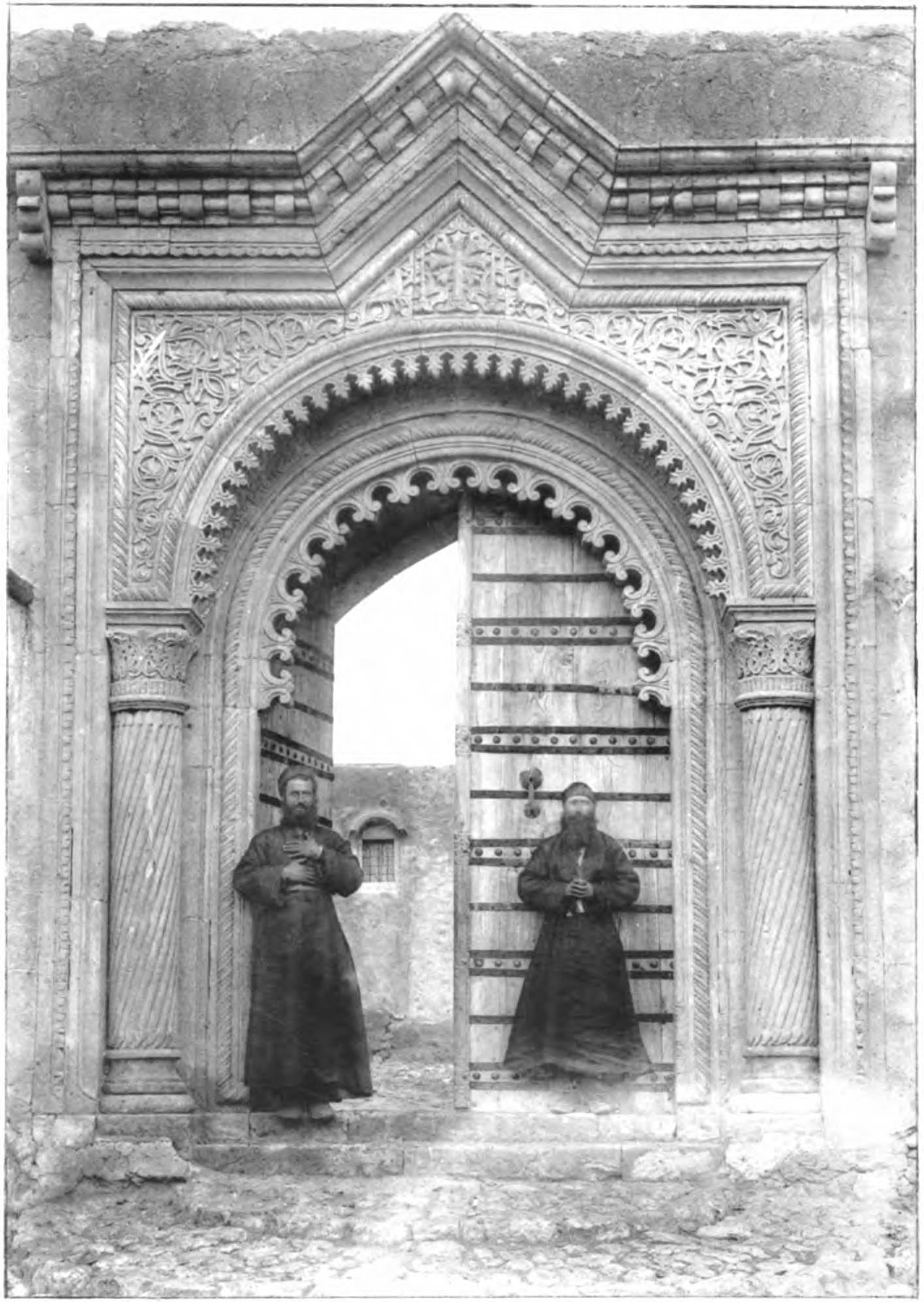 Two monks at the gate of the new monastery of Rabban Hormizd, Alqosh, 1897