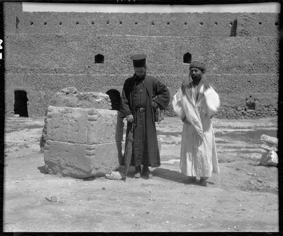 Priest by the carved font of Mar Yuhanna church, Qaraqosh, 1909
