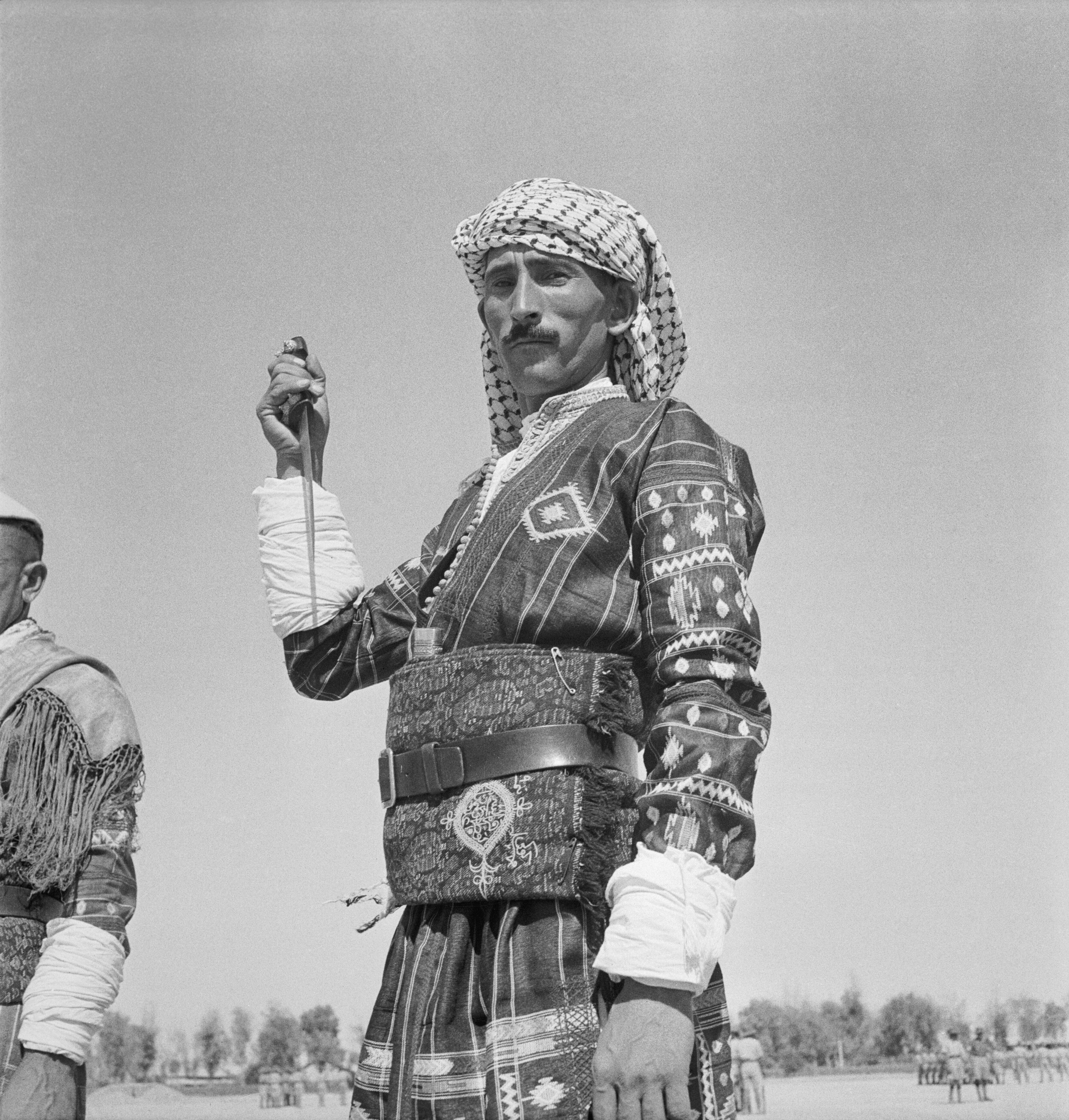 Iraq Levy with raised dagger, photographed by Cecil Beaton, 1942