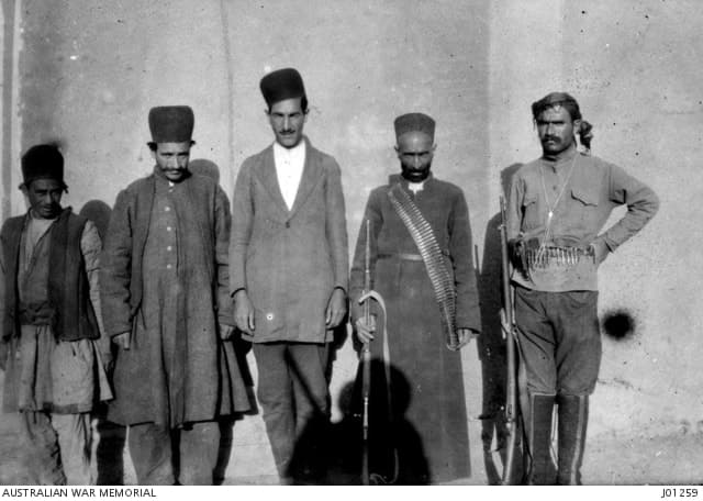 Sagis Yarn, Assyrian interpreter from Urmia, with visitors at Korkora