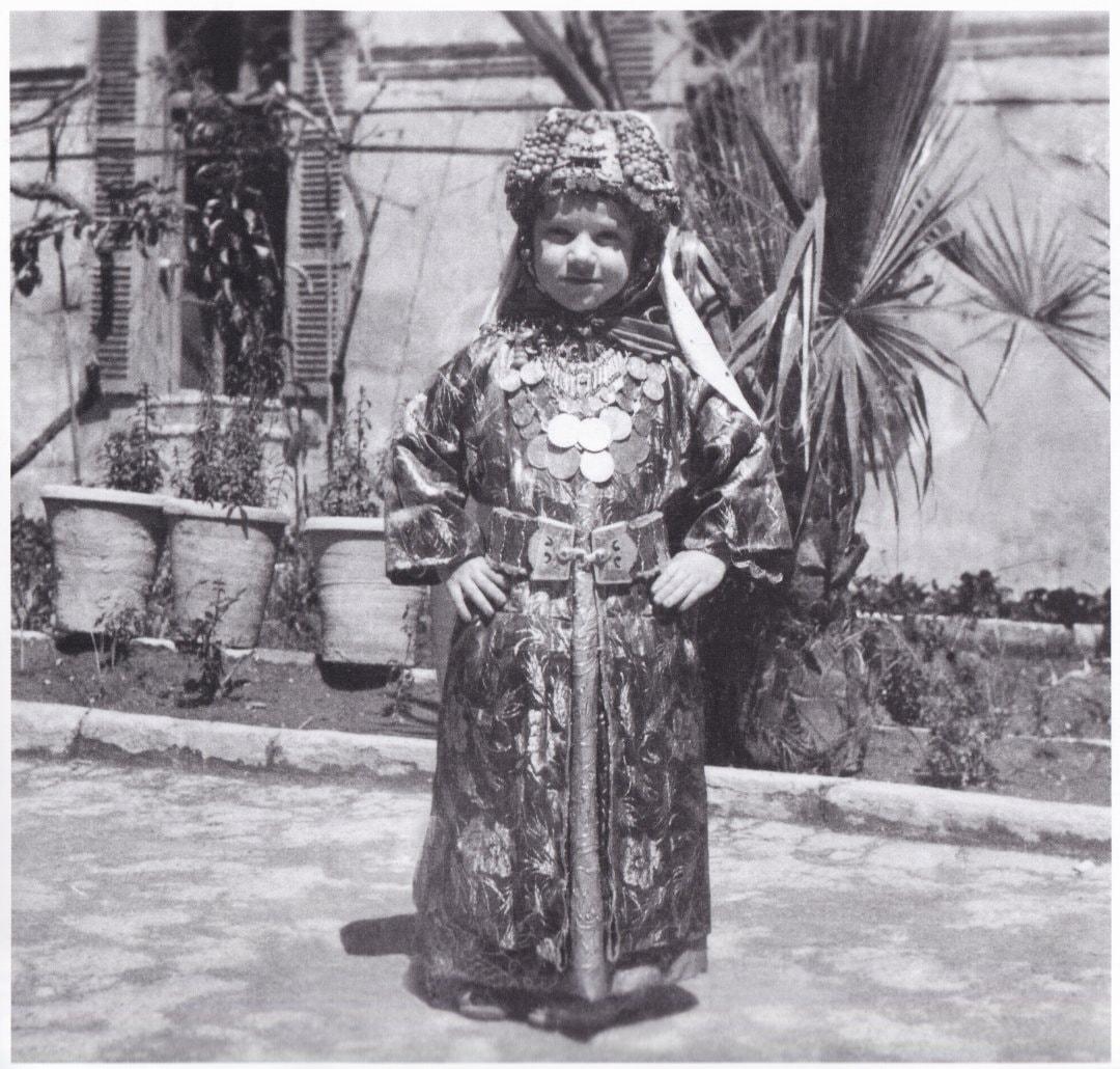 Girl in traditional Tel Keppe dress, 1953