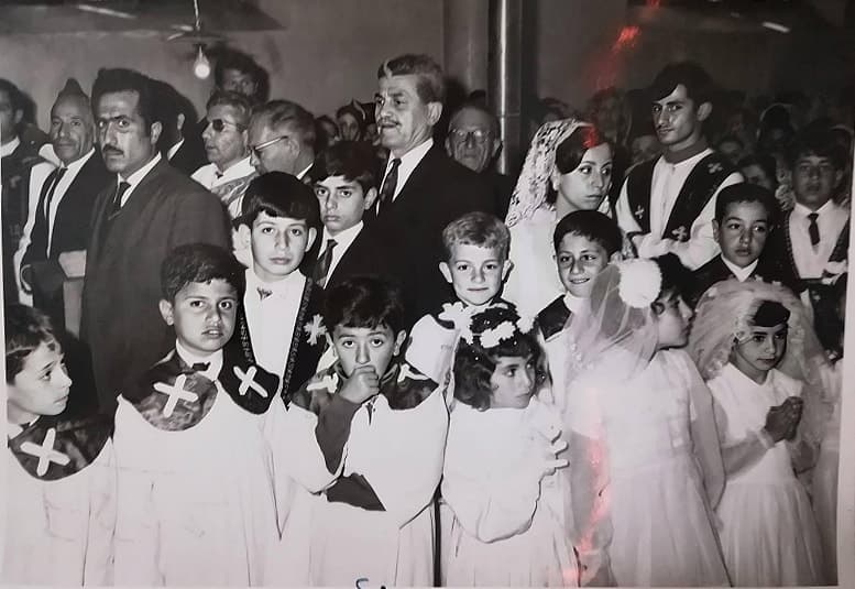 First communion children and clergy in a Syriac Orthodox church, 1960s