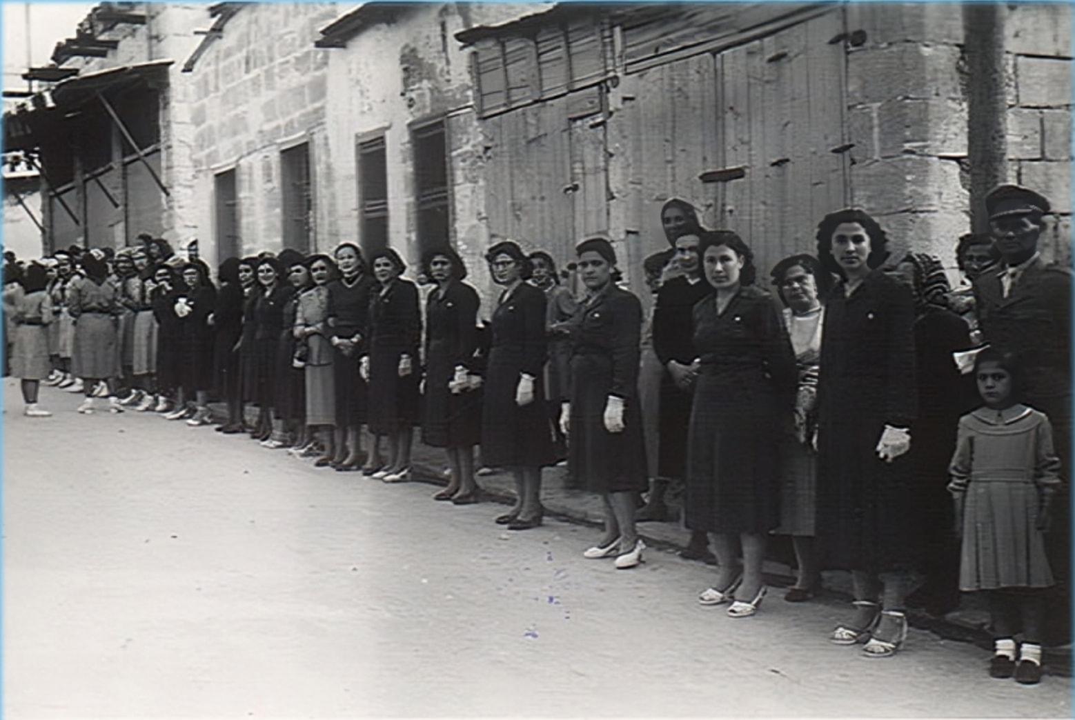 Women line the street for Patriarch Aphrem I Barsoum's visit, Aleppo, 1953