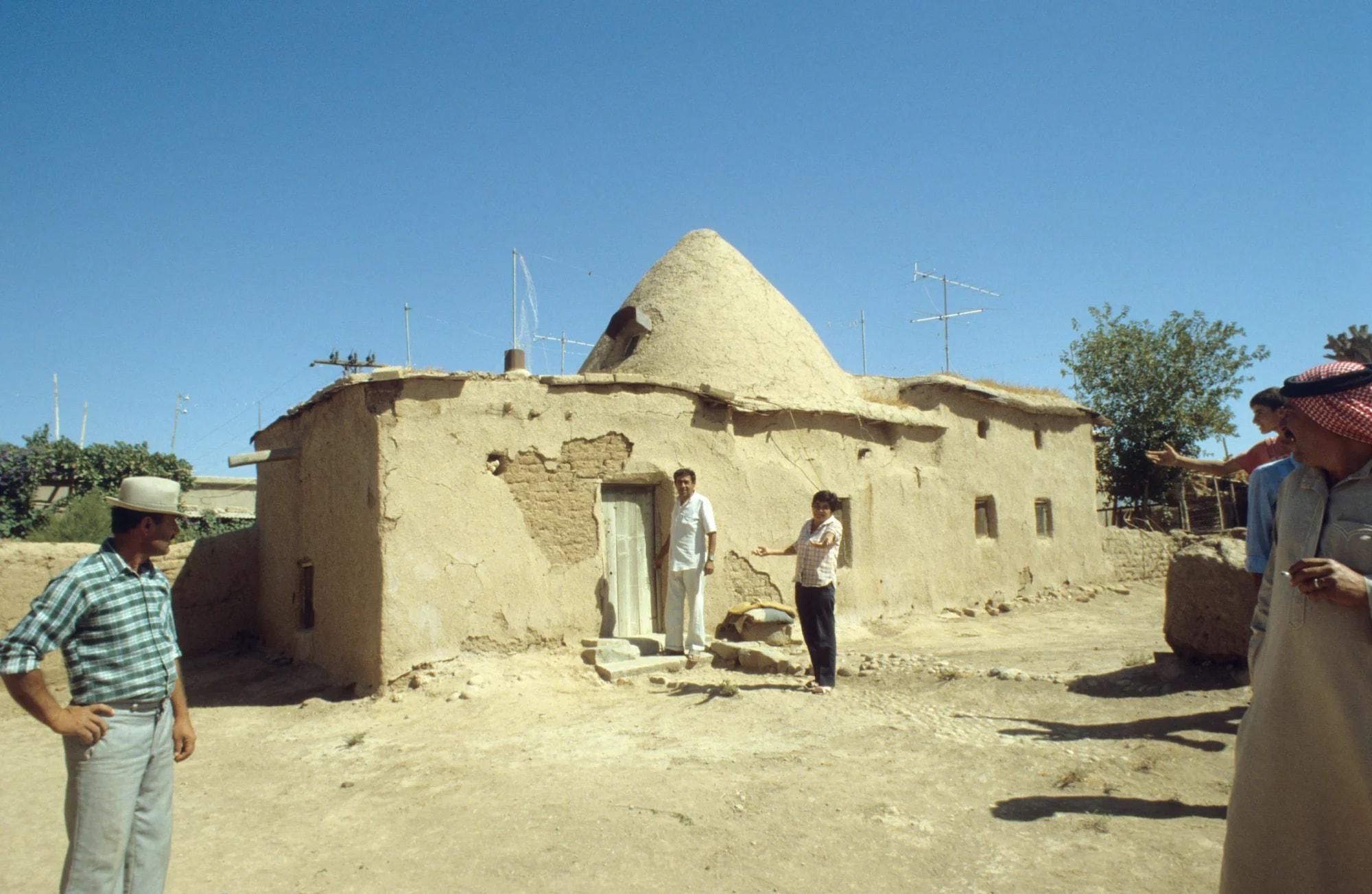 Men outside a domed house in an Assyrian village near Tel Tamer, 1987