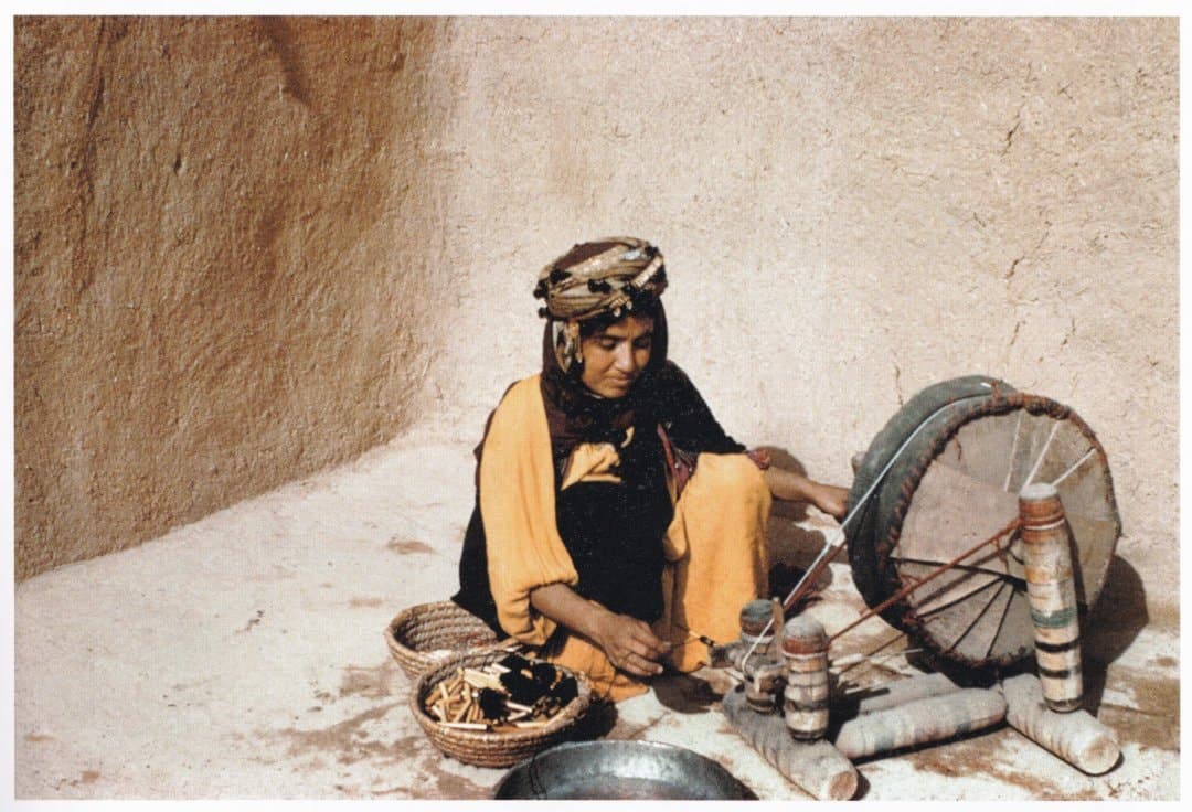 Young woman of Ankawa spinning wool, about 1950