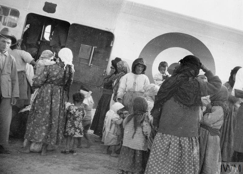 Assyrian refugee women and children at an RAF aircraft door, Mosul, 1933