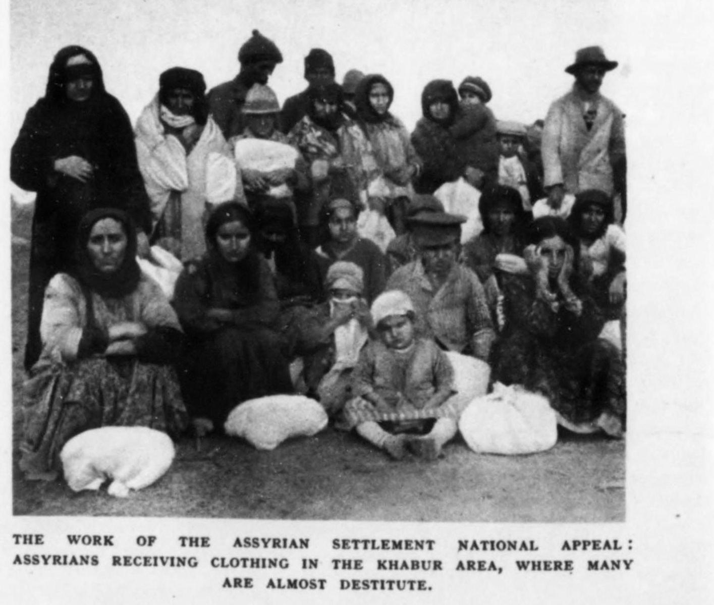 Assyrian refugees receiving clothing on the Khabur, 1936