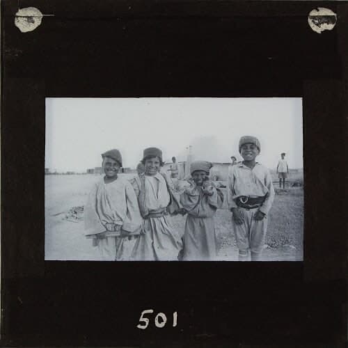 Jilu Assyrian boys smiling at Baqubah refugee camp