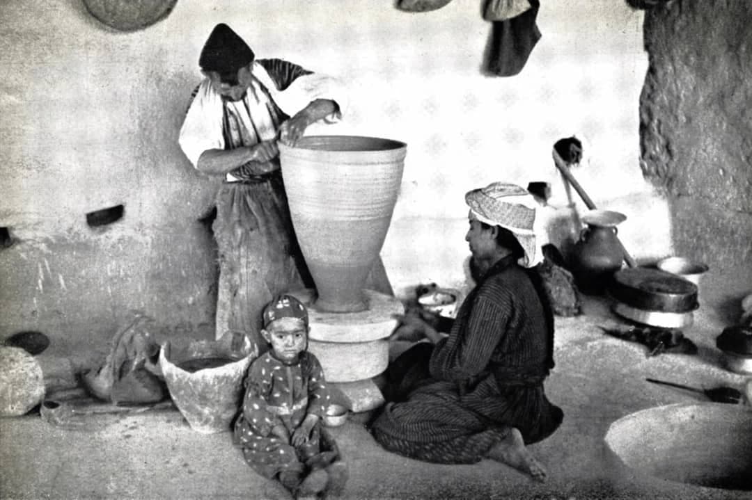 Assyrian family making pottery, c. 1937
