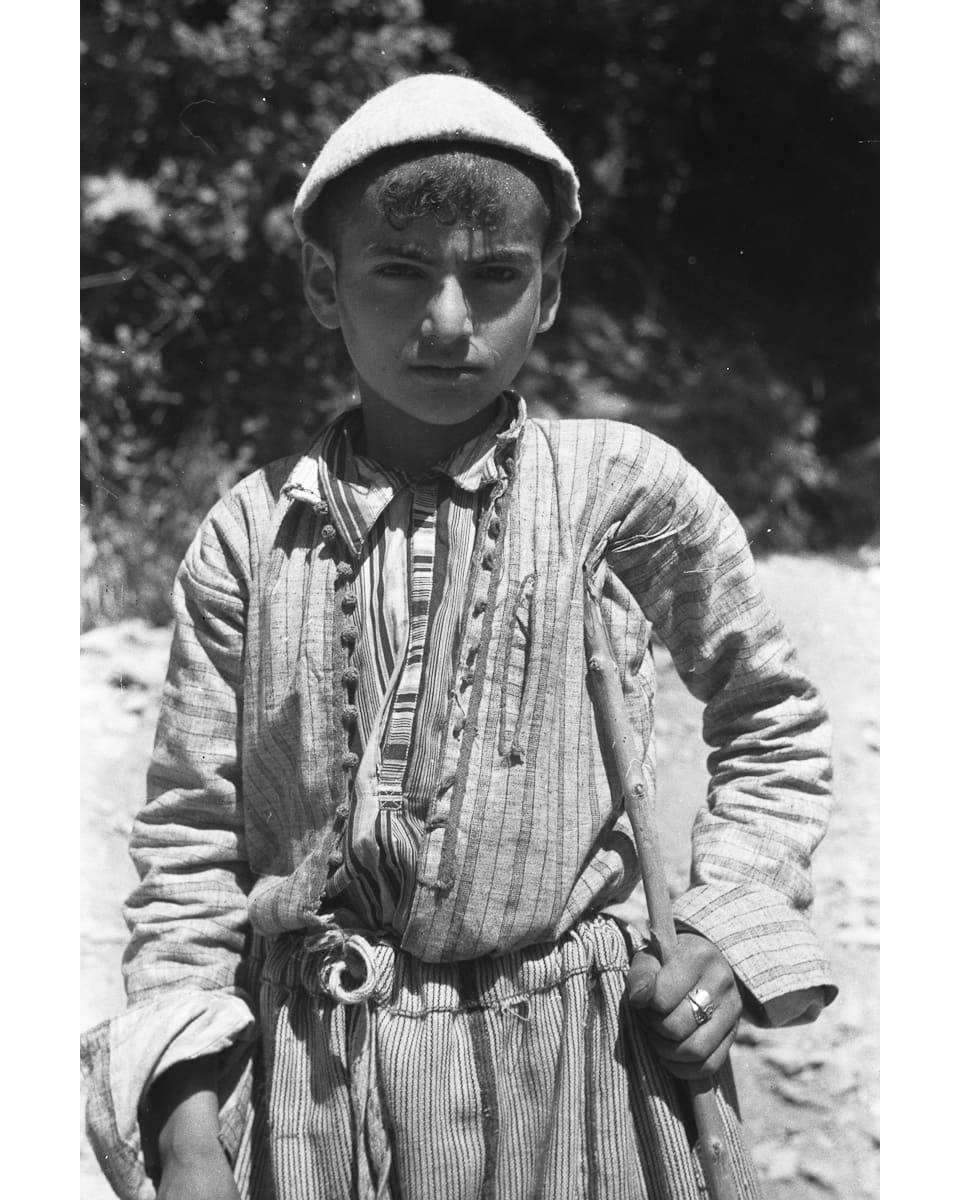 Assyrian boy with a stick