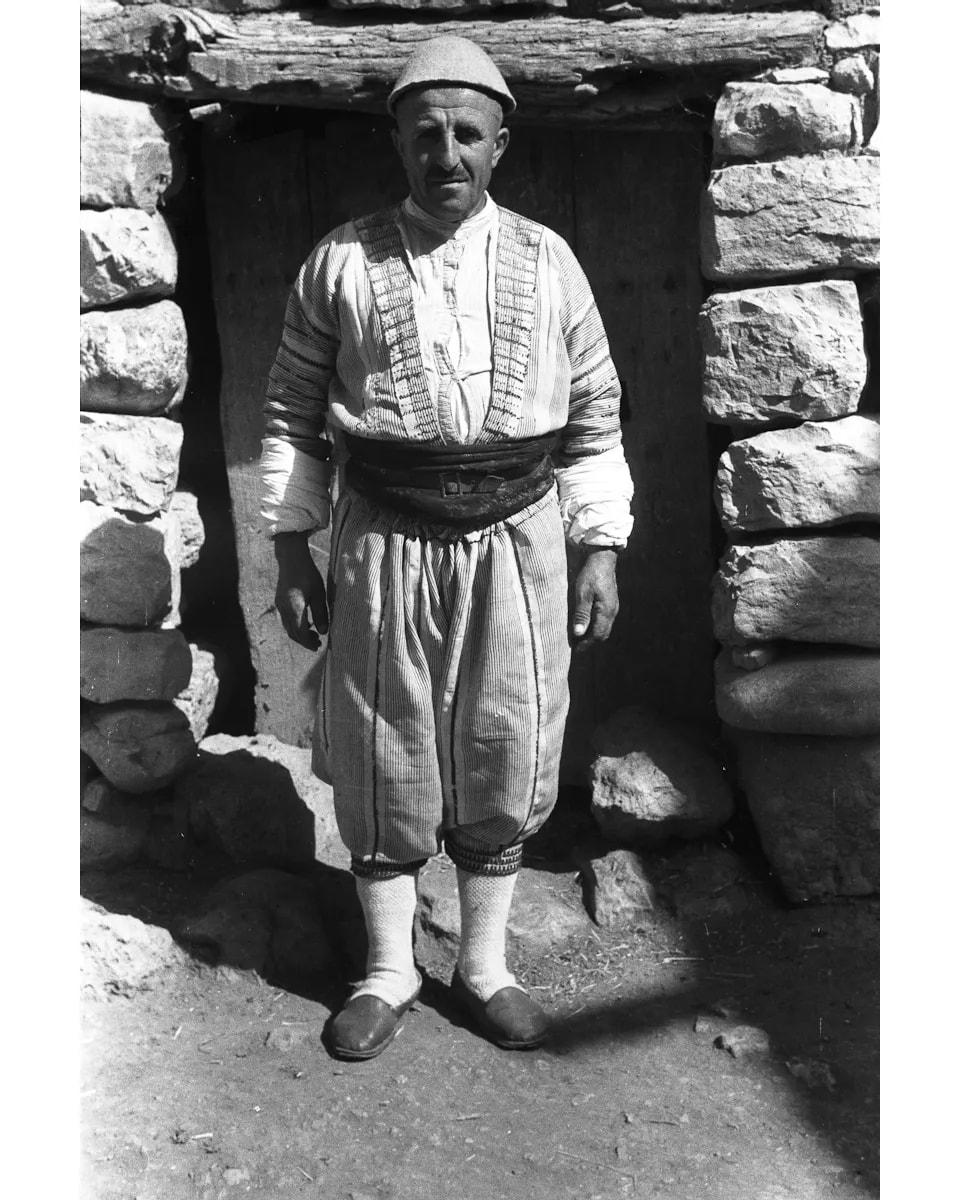 Assyrian man at a doorway in Ain Nuni