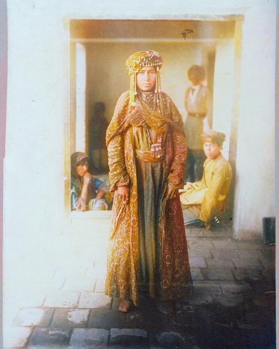 Chaldean woman in patterned dress and jewelled headdress, Salamas